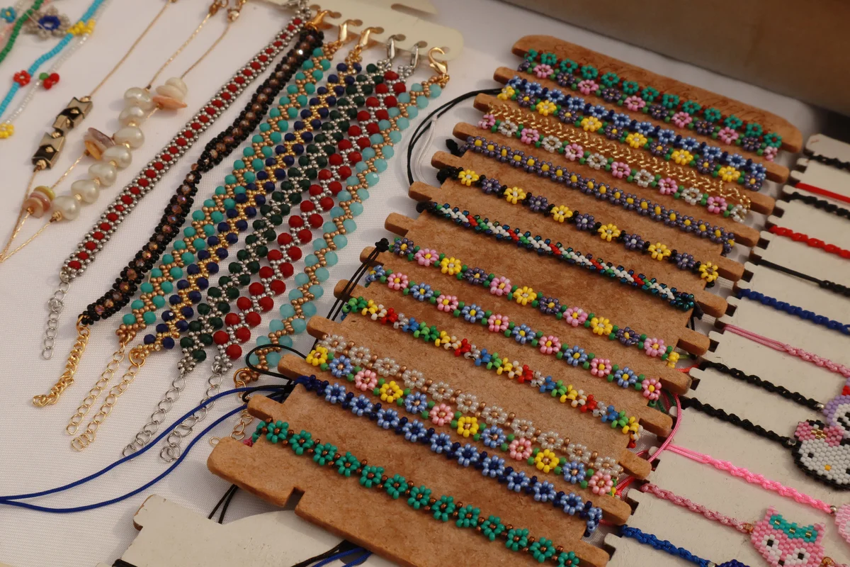 Handmade beaded bracelets displayed by the artisan