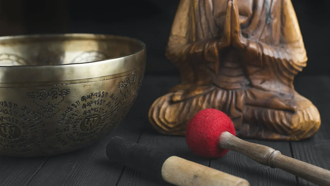 Tibetan singing bowl and Buddha statue for spiritual meditation
